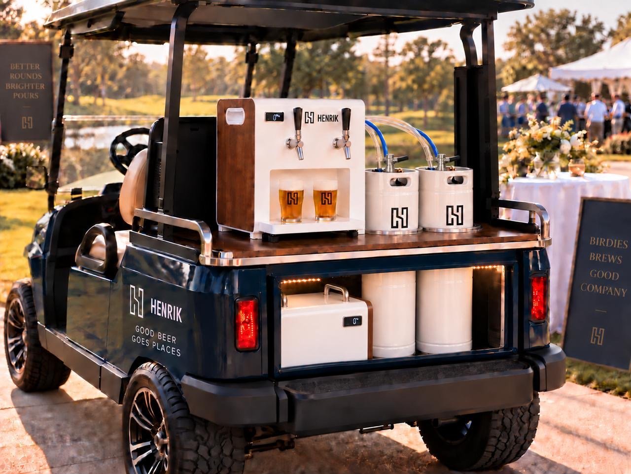 A Henrik draft machine and kegs on the back of a golf cart at an outdoor event
