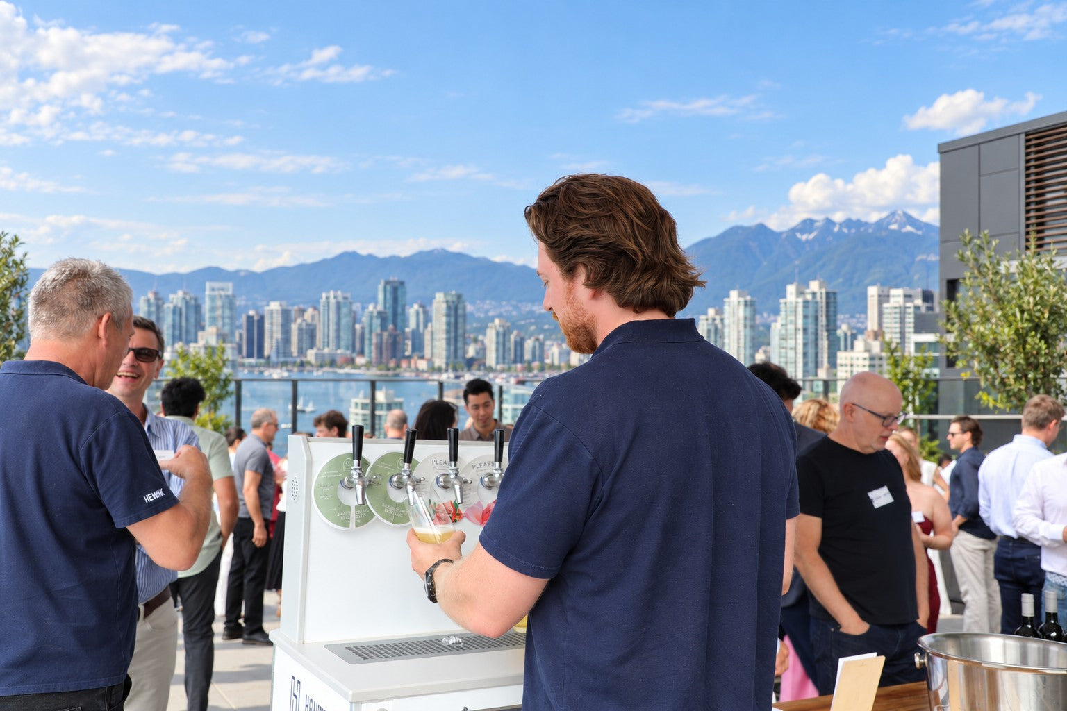 A two-tap Henrik machine and two kegs on the back of a golf cart at an outdoor wedding, two full glasses on the deck